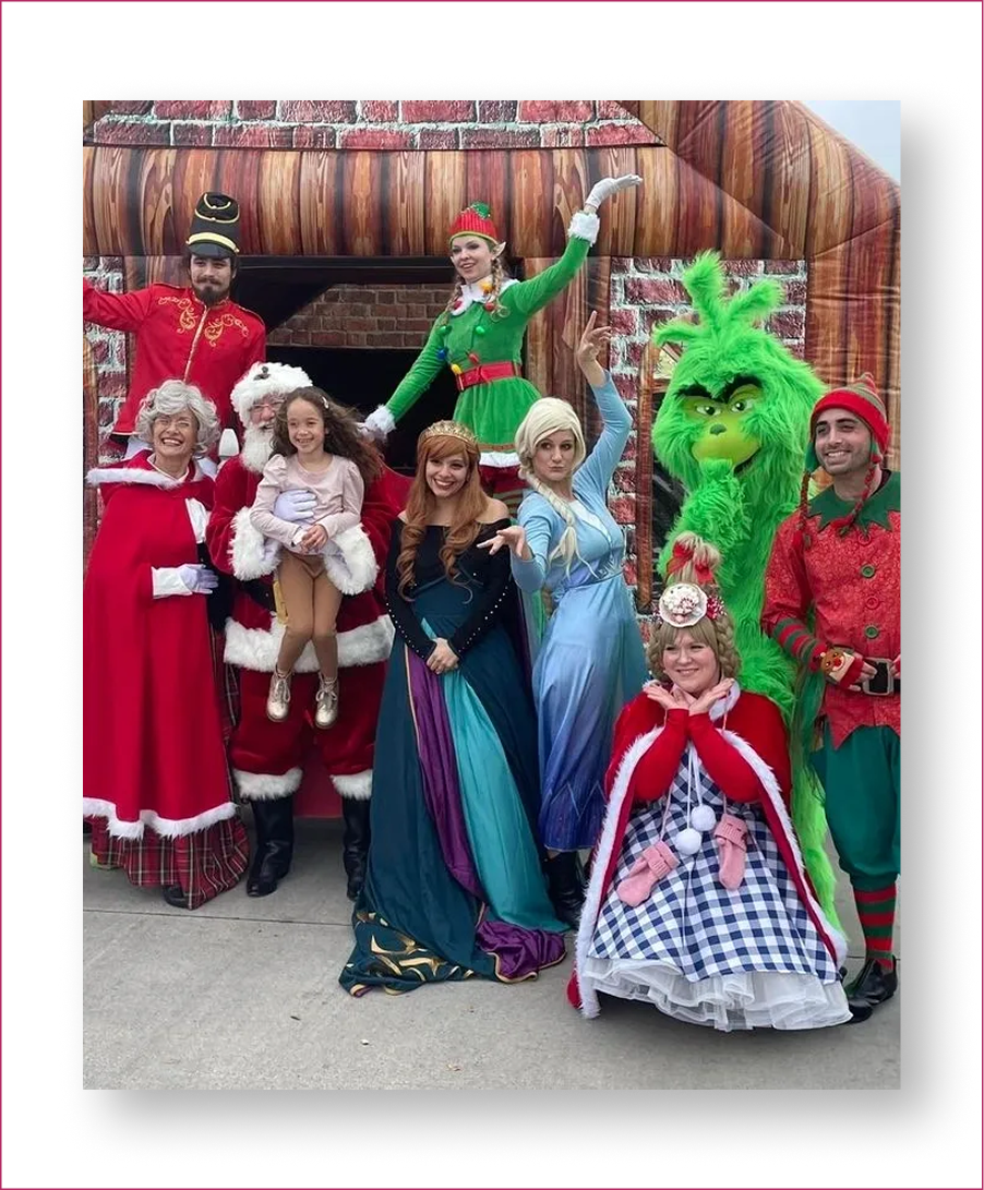 Festive characters posing in colorful costumes outside.