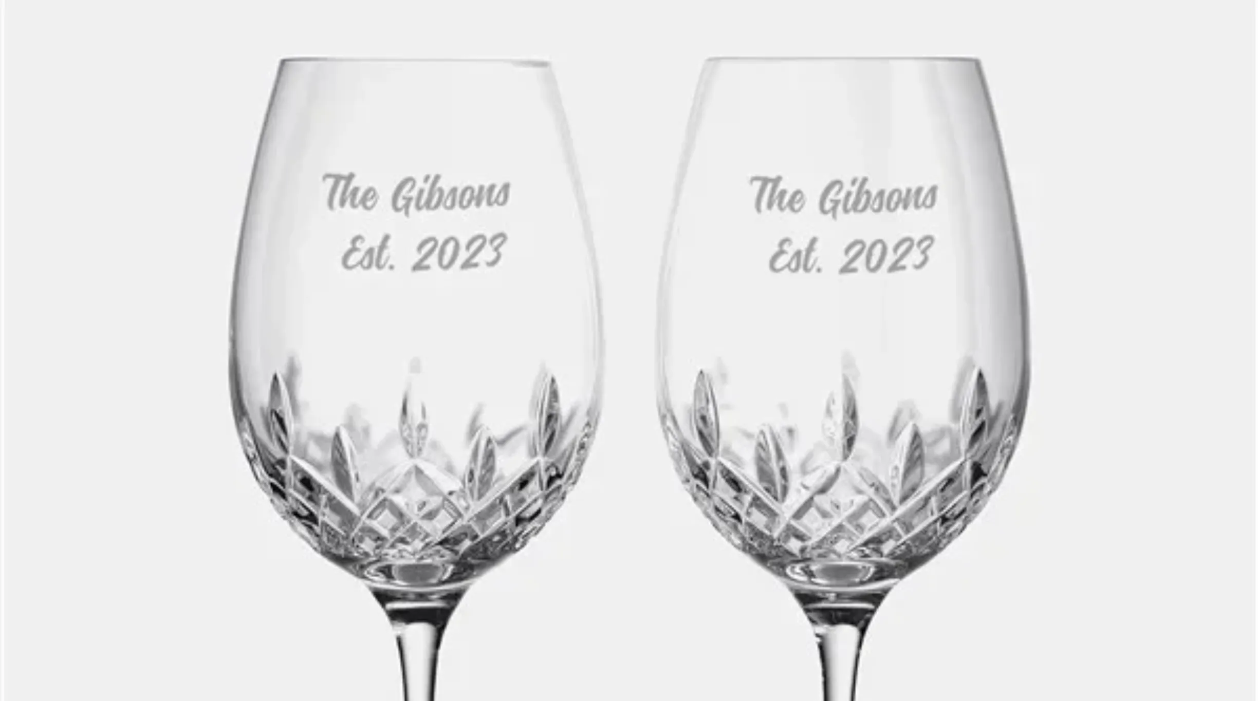 Two elegant engraved wine glasses with "The Gibson Est. 2023".
