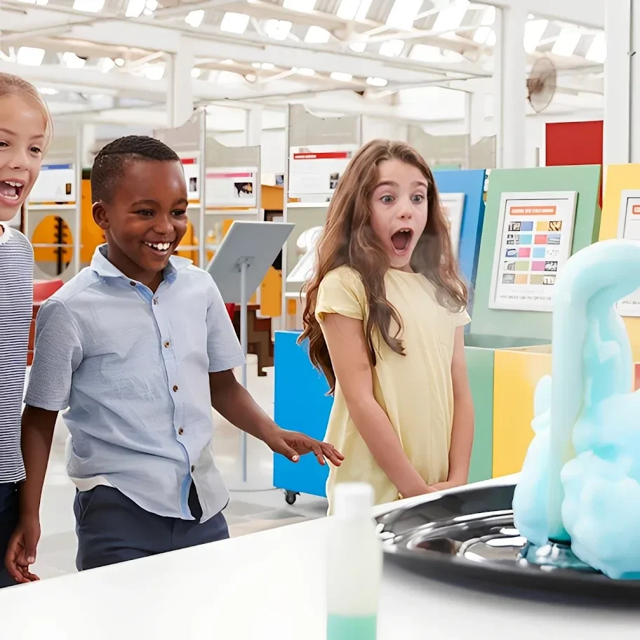 Children amazed by science experiment in classroom.